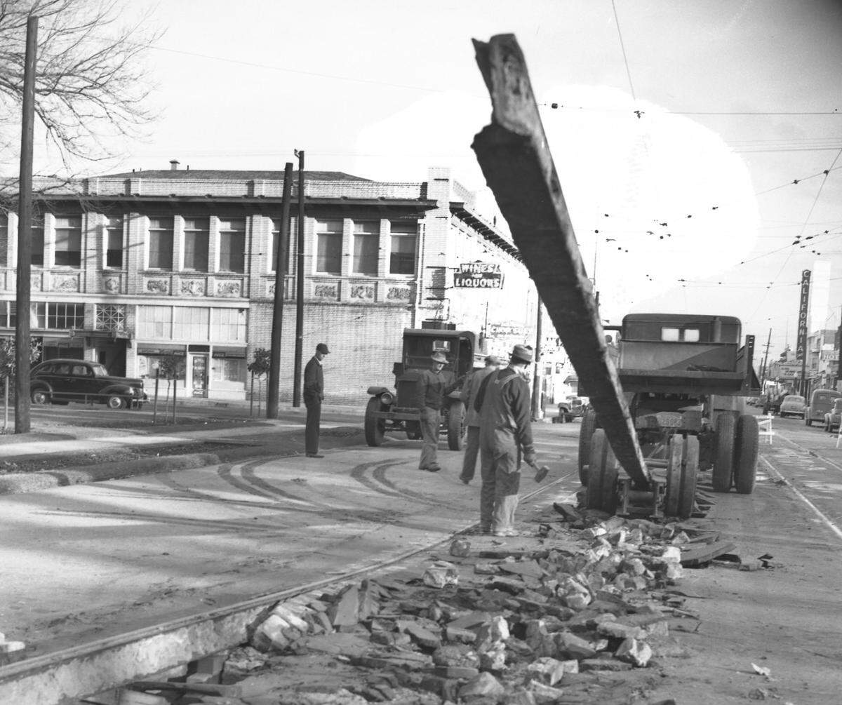 Workers remove the first section of Sacramento’s streetcar rails in 1947 at the 35th Street entrance to James McClatchy Park in the city’s Oak Park neighborhood. “The rails were made useless when the streetcars were abandoned in favor of buses,” wrote The Bee at the time.