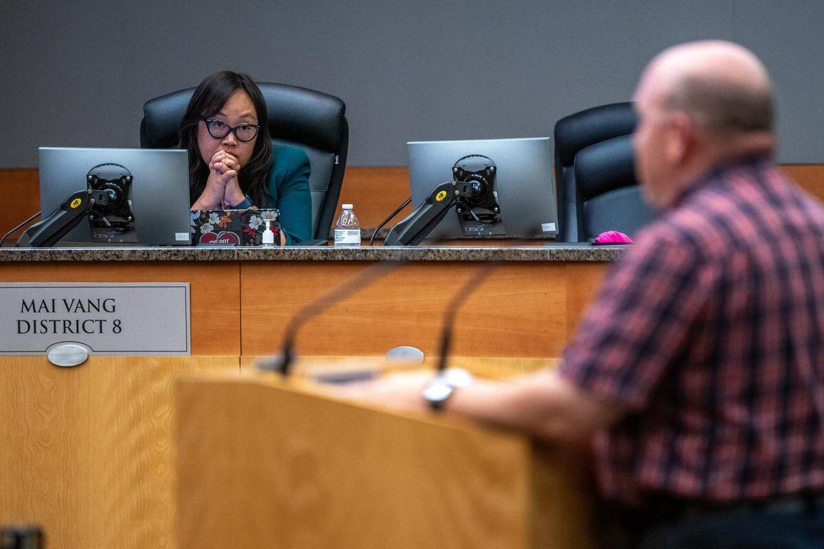 Councilmember Mai Vang listens to a speaker at a Sacramento City Council meeting on Tuesday. Vang was opposed to charging seniors a 30% fee for housing at a proposed micro-community. 