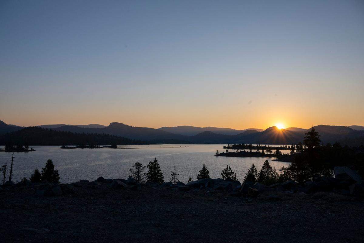 The sun rises over Loon Lake in El Dorado County before the Jeep Jamboree on June 11, 2025.
