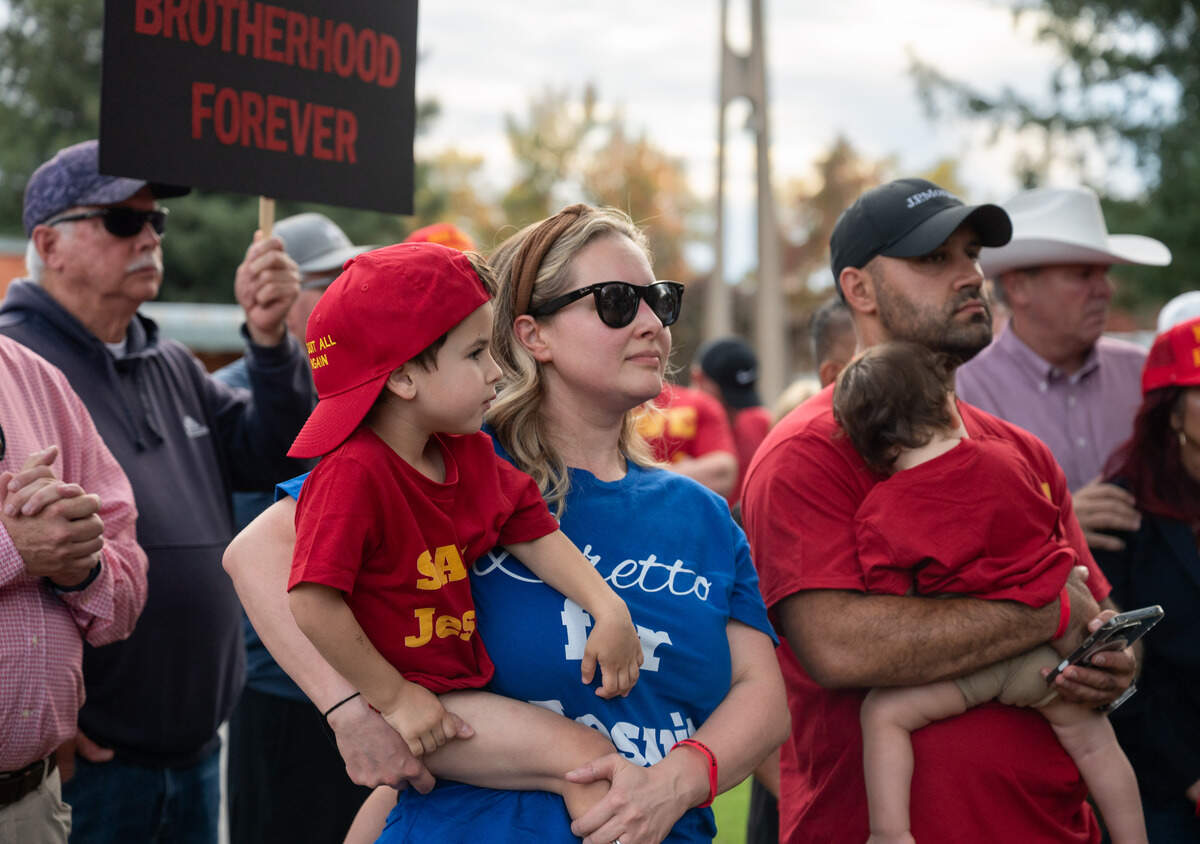 Parents Kristen and Philip DeSouza attend a rally with their boys Alexander, 3, and Christopher, 1, on Tuesday against the proposal to allow girls to attend the Carmichael high school. Philip graduated from Jesuit and Kristen attended all-girls Loretto High School, which has since closed.