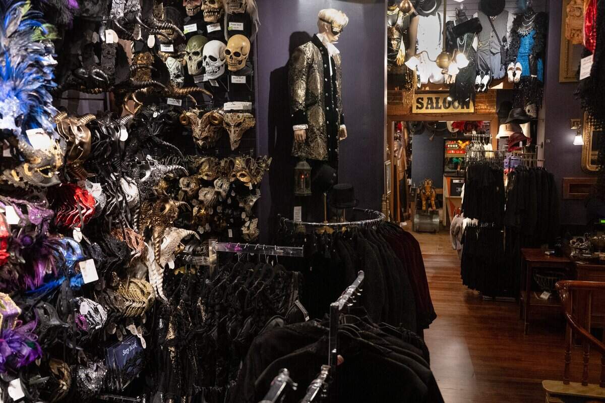 Masks and cloaks line the walls on the second floor of Evangeline’s Costume Mansion in Old Sacramento. The store celebrated its grand reopening on Friday after being closed for just over a year due to fire damage.