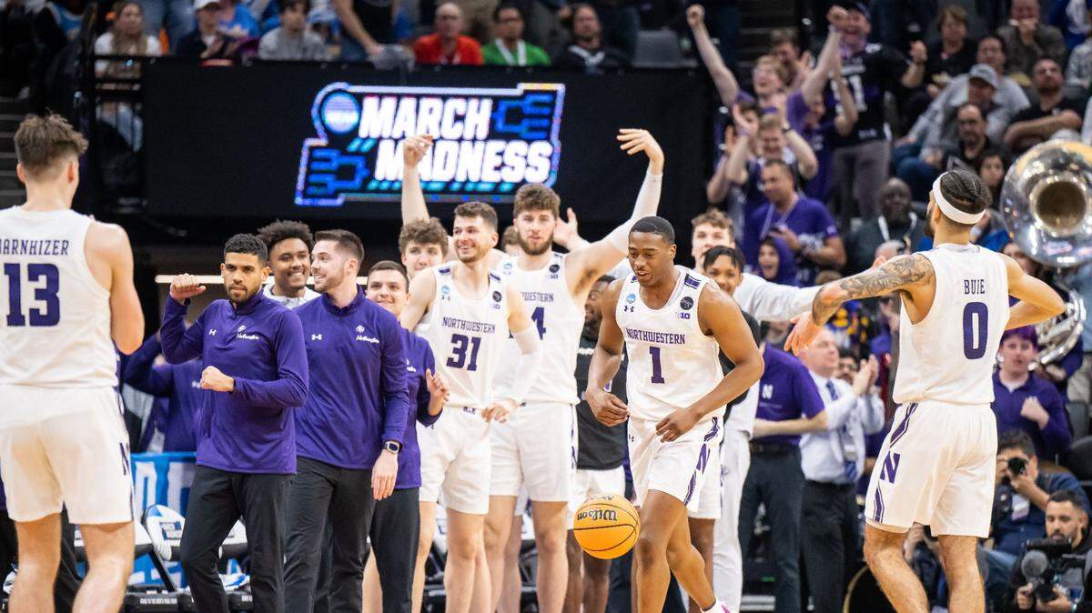 The Northwestern Wildcats start to celebrate as the seconds wind down on their 75-67 win over the Boise State Broncos at the NCAA Tournament at Golden 1 Center on Thursday, March 16, 2023, in Sacramento.