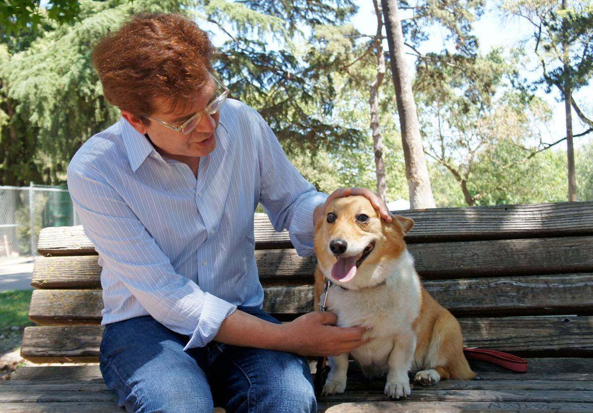 Sacramento Bee editorial cartoonist Jack Ohman asks California first dog Sutter Brown “Who’s a good boy?” in the summer heat at McKinley Park in East Sacramento in 2013.