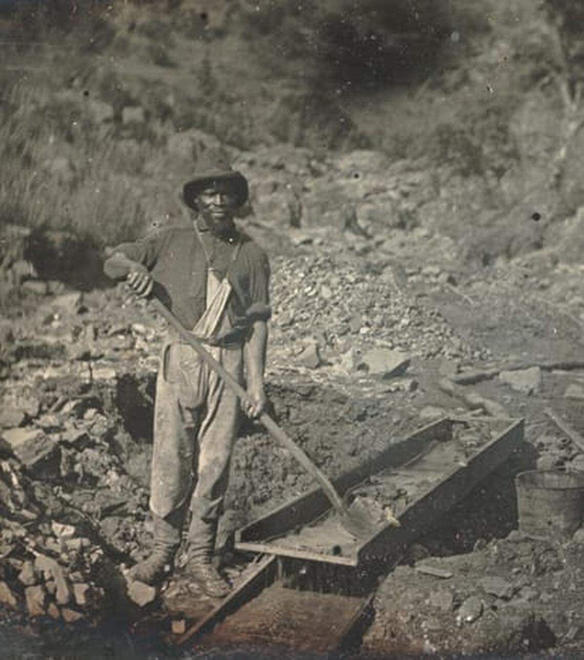 An unidentified Black miner works a sluice in Placer County, likely near the Auburn Ravine, in 1852 at the height of the Gold Rush. Nearby on the American River was an area now known as Negro Bar, where many Black miners worked.