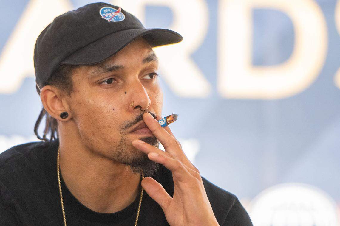 Michael Johnson smokes a prerolled joint in the cannabis consumption lounge during the California State Fair in Sacramento on Tuesday, July 16, 2024.