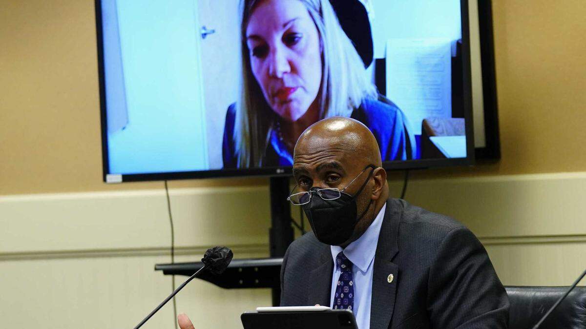 Assemblyman Jim Cooper, D-Elk Grove asks a question to Nancy Farias, the newly appointed director of the California Employment Development Department, seen in video monitor, during a hearing of an Assembly budget subcommittee at the Capitol. Farias told lawmakers that the state stopped $120 billion worth of fraud attempts in 2020 and 2021 but that doesn’t include the $20 billion in fraud the state failed to stop.