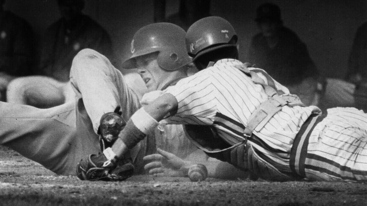 Cordova’s Geoff Jenkins is safe stealing home as Grant’s catcher Robert Tucker can’t hold the ball. Action from their game Wednesday at Cordova. 4-15-92.