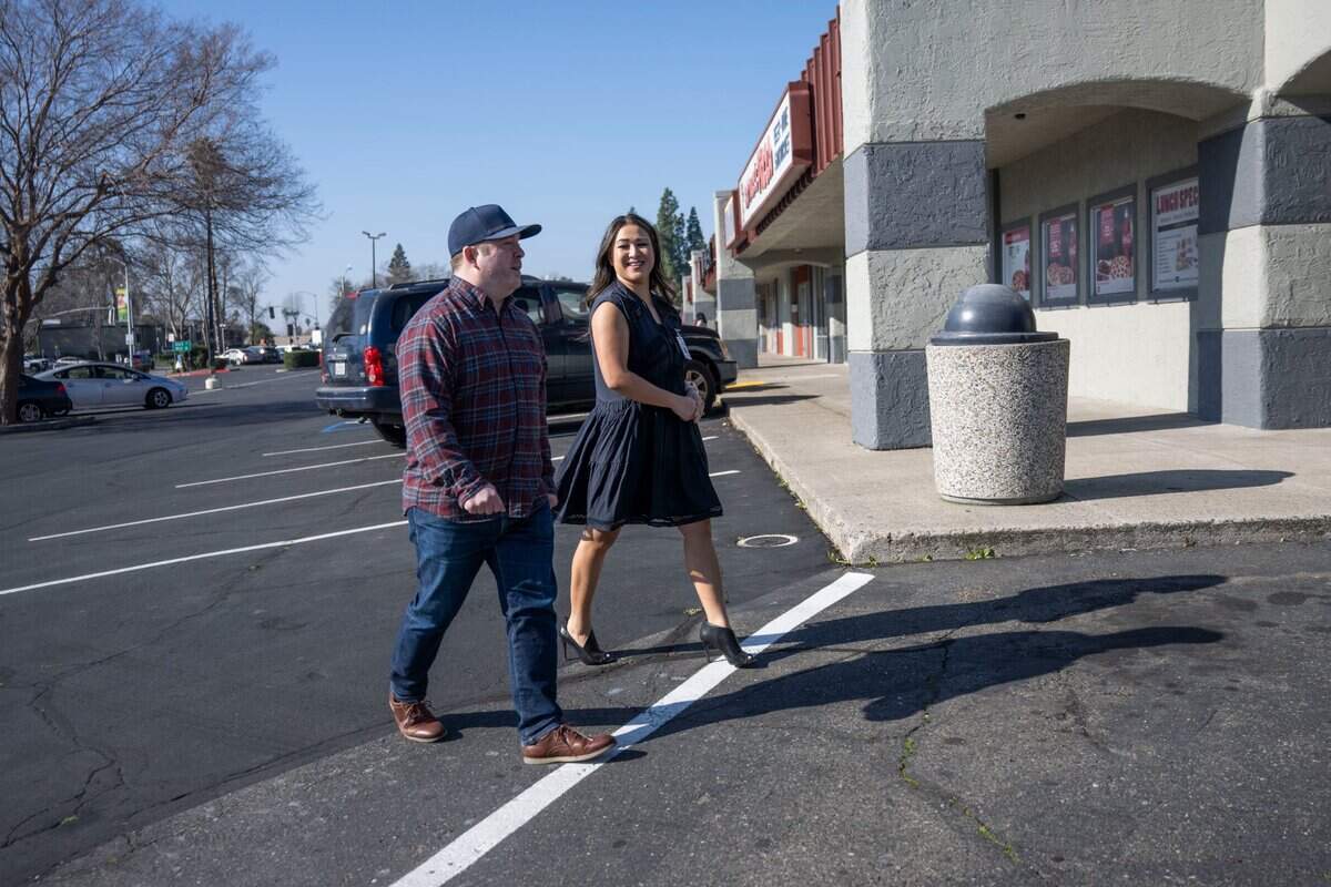 Valley High resident Noah Painter walks with Vicky Magobet, CEO of Diamond House Detox, on Thursday. Painter and Magobet said they are against the proposed Culture Cannabis Club Dispensary around the corner from the detox facility where her clients attend rehab classes.