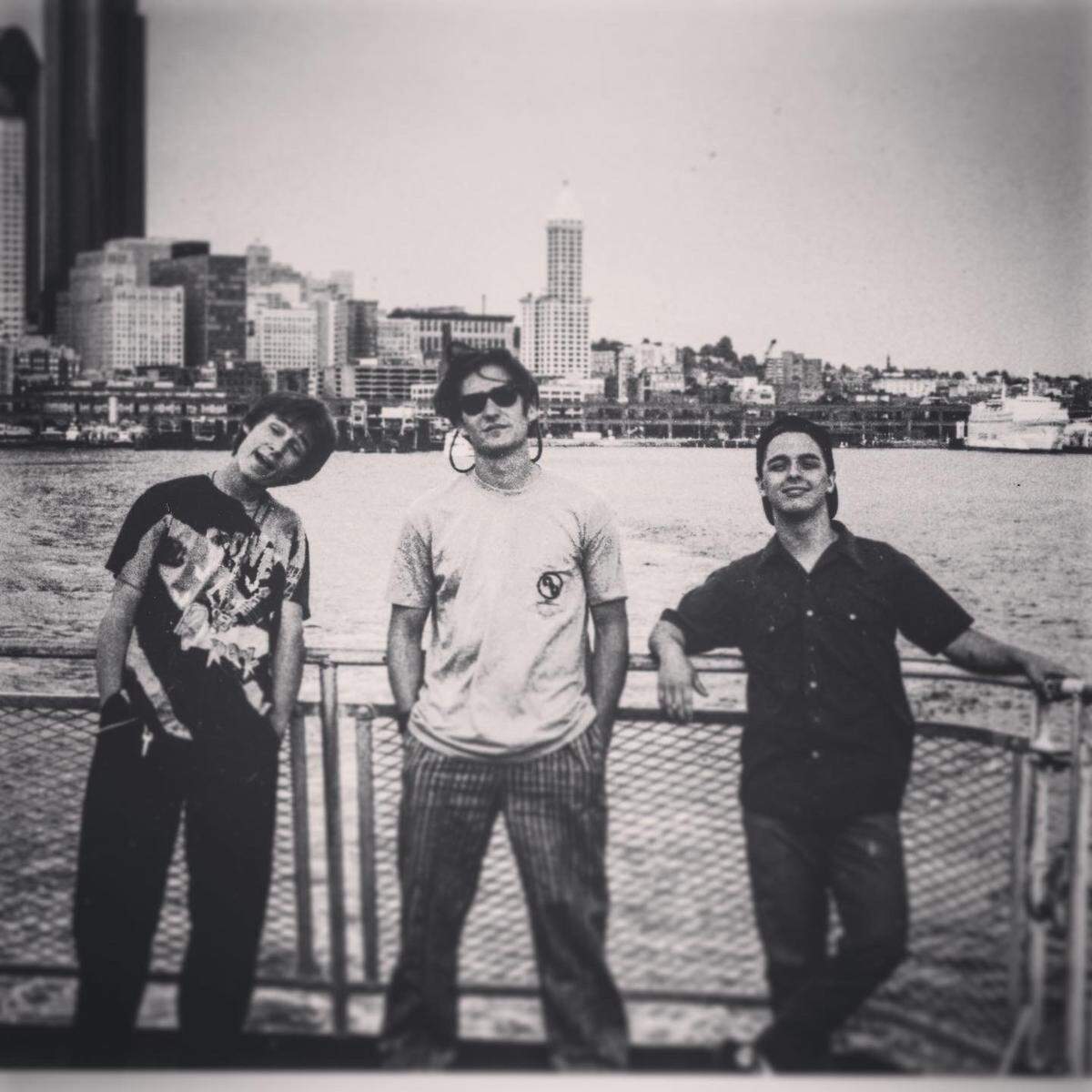 A photo of Green Day on tour in Seattle in 1990: Mike Dirnt, left, John Kiffmeyer, center, and Billy Joe Armstrong, right.