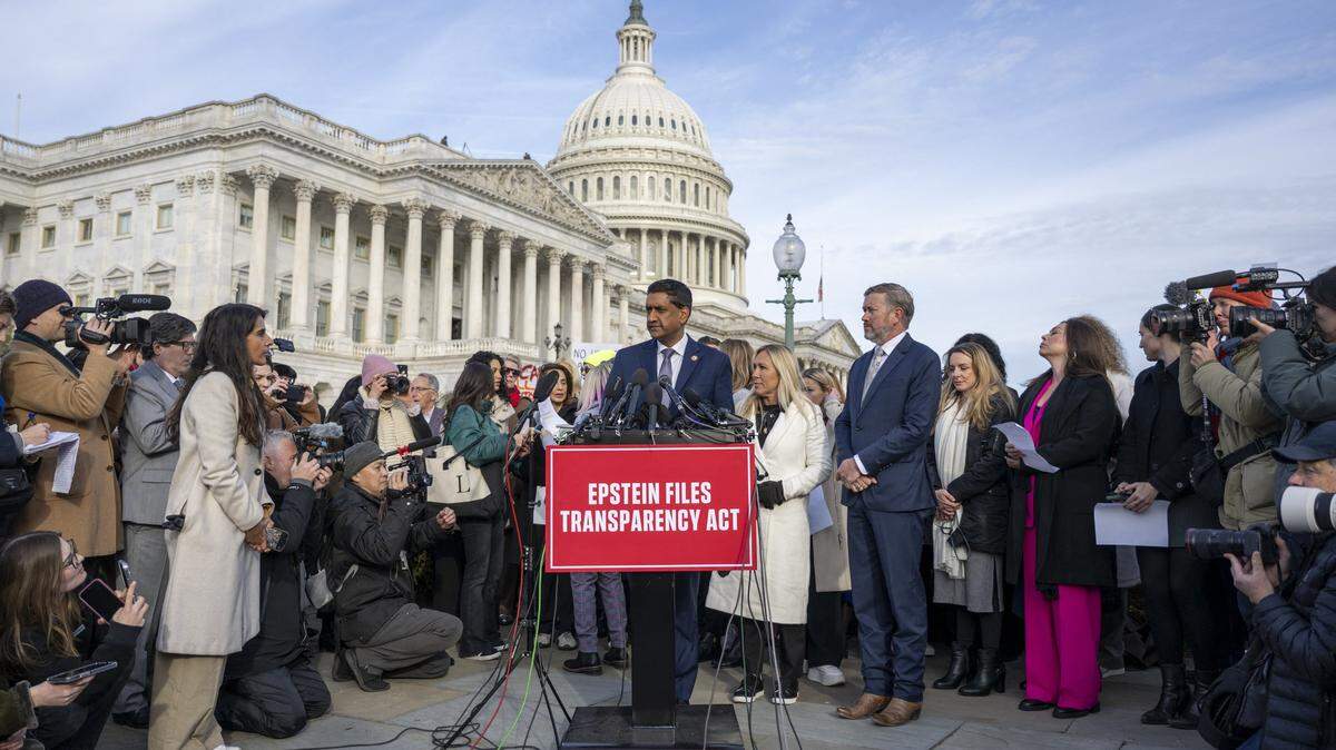 Rep. Ro Khanna (D-CA) (C) speaks alongside Rep. Marjorie Taylor Greene (R-GA) (C-L) and Rep. Thomas Massie (R-KY) (R) during a news conference on the Epstein Files Transparency Act at the US Capitol in Washington, DC, on November 18, 2025. US lawmakers are expected to vote Tuesday for the release of government records on sex offender Jeffrey Epstein, in defiance of President Donald Trump's attempts to keep a lid on one of the country's most notorious scandals. (Photo by DANIEL HEUER / AFP) (Photo by DANIEL HEUER/AFP via Getty Images)