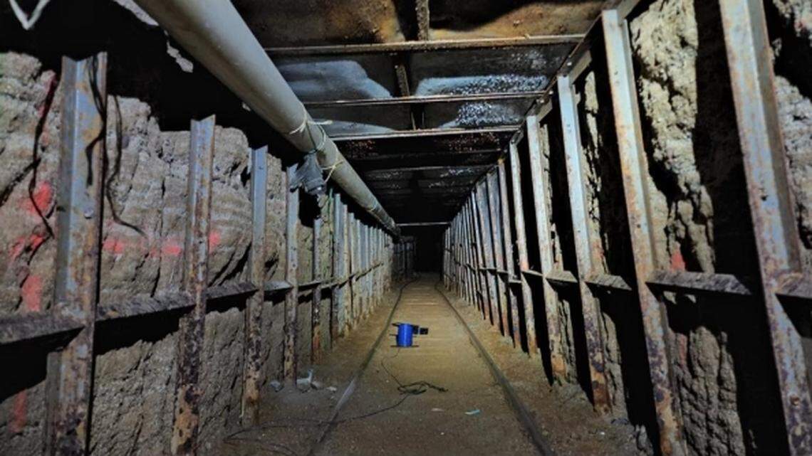 A 1,744-foot long border drug tunnel between Tijuana and a California warehouse has been shut down, federal officials said. Six people face charges.