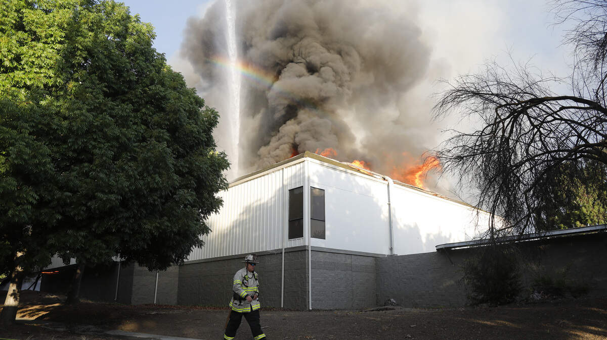 San Jose Fire Department firefighters battle a three-alarm fire at the Public Storage facility at 88 Blossom Hill Road in south San Jose on June 14, 2023.