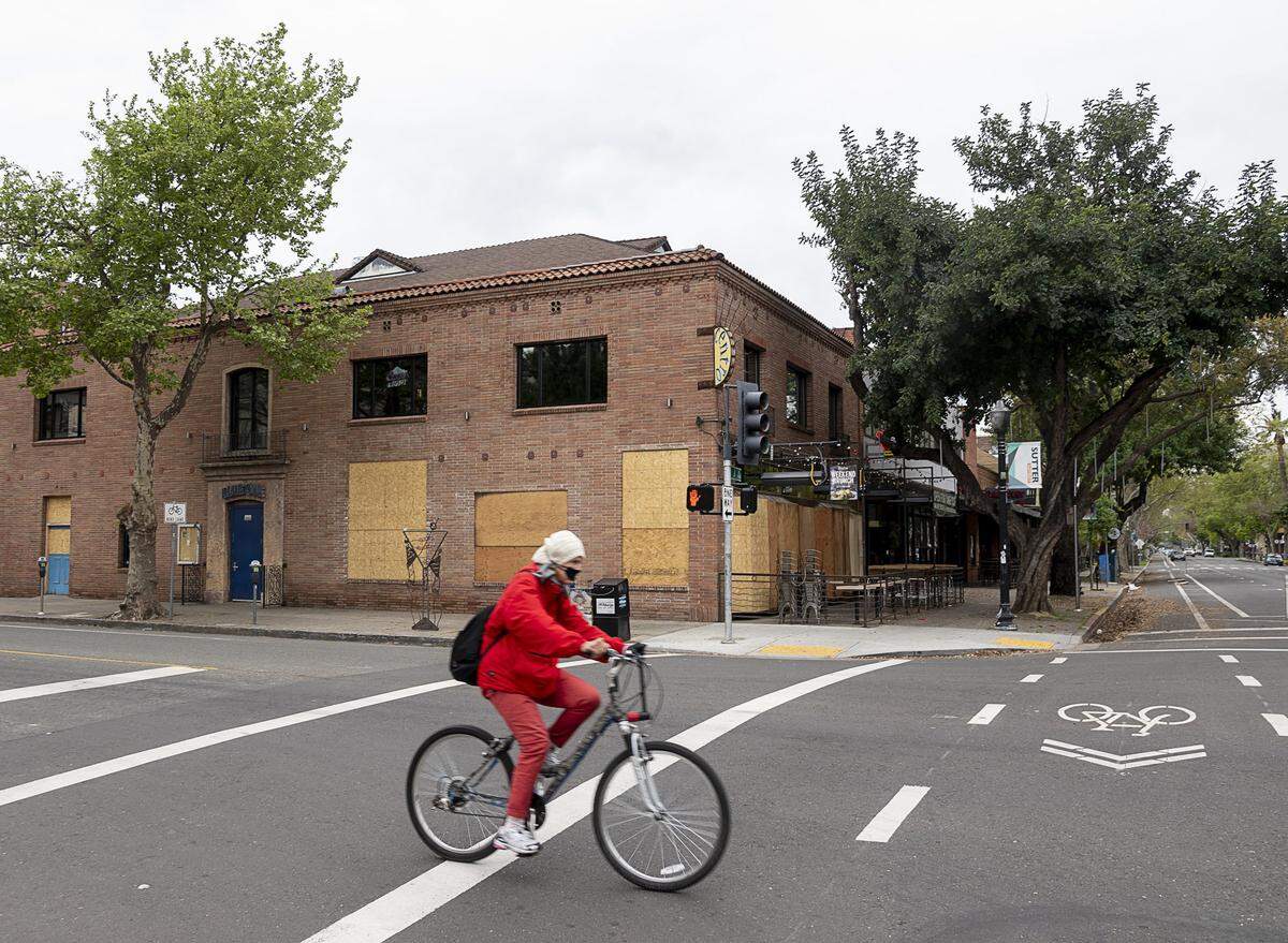 Plywood protects the windows of Centro Cocina Mexicana, one of the Paragary restaurants that has temporarily closed, in midtown Sacramento on Wednesday, April 8, 2020, during the coronavirus pandemic.