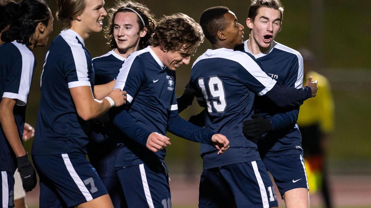 Vista del Lago’s Abdulkareem Ba (19), second from right, is congratulated by teammates after scoring against Galt during the second half of the high school boys soccer Sac-Joaquin Section playoff game Tuesday, Feb. 15, 2022, at Vista del Lago High School in Folsom. Vista del Lago beat Galt 6-1.