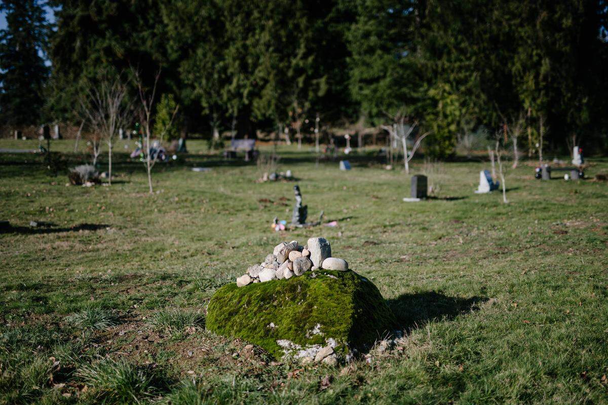 A boulder from an old river bed found on Woodlawn Cemetery’s land acts as a headstone for several green burial plots, in Snohomish, Wash., Jan. 7, 2019. Washington became the first state to permit human remains to be reduced to soil through composting, or recomposition. (Grant Hindsley/The New York Times)