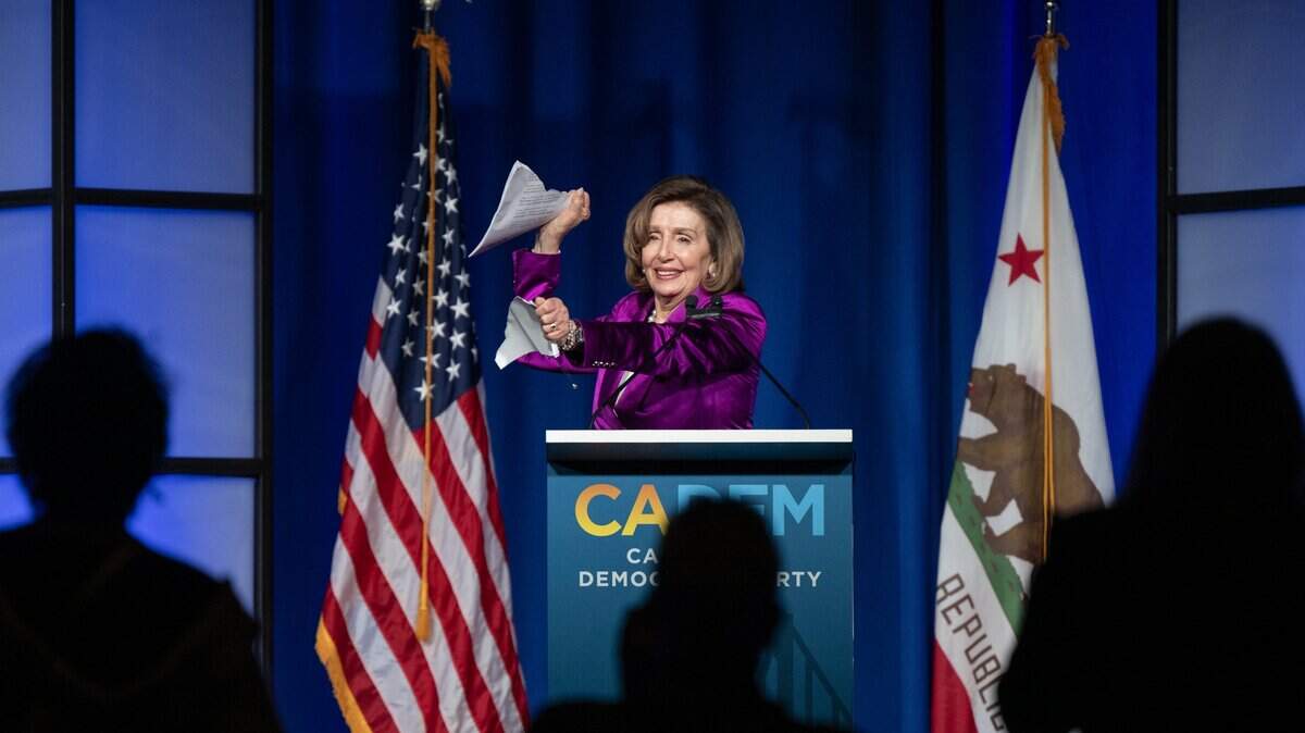 Former House Speaker Nancy Pelosi tears up her speech before speaking at the dinner in her honor Saturday, Feb. 21, 2026, during the California Democratic Party state convention in San Francisco.