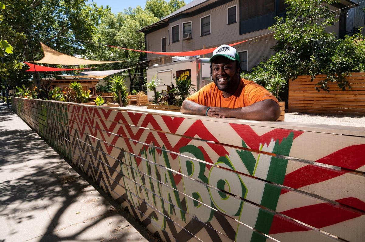 Rasheed Amedu, chef and owner of Naija Boy, sits in the outdoor dining area on July 6. After cooking at Urban Roots and TableVine and trying Naija Boy as a pop-up, Amedu is taking Nigerian ingredients and flavors and spinning them through a Mexican fusion lens to make tacos.