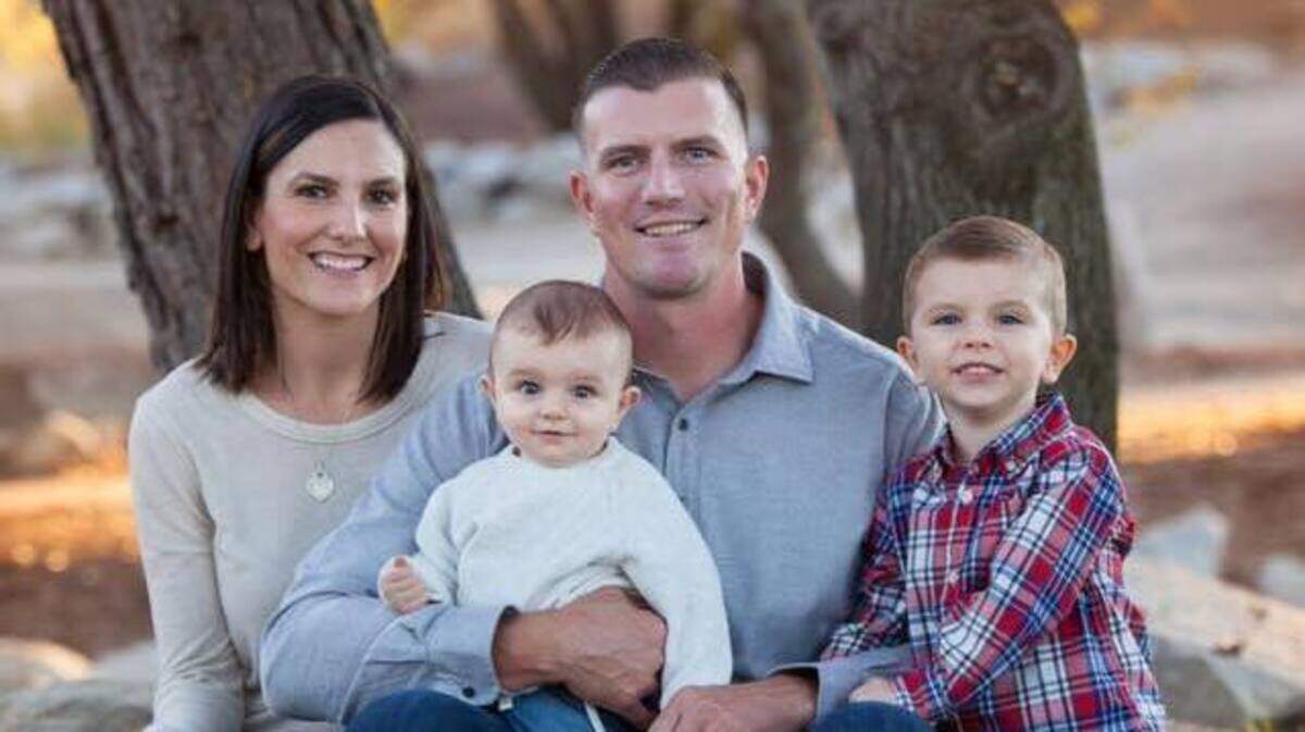 Officer Cameron Landon, 36, with his wife and children. Landon was found dead Tuesday morning after dying in his sleep overnight, the Roseville Police Department said.