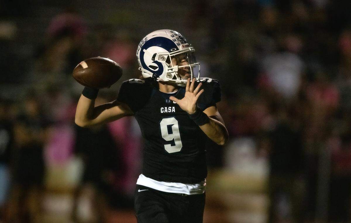 Casa Roble Rams quarterback Tristan Molina (9) throws to Logan March for a two-point conversation against Pioneer near the end of the second quarter on Friday.