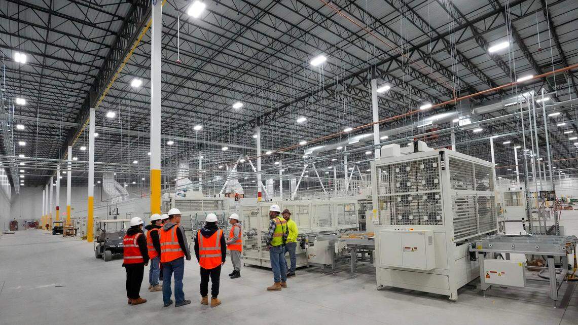 Construction subcontractors work to build a solar panel factory in Ohio in 2023. Assembly Bill 1280 would help modernize industrial facilities in California. 