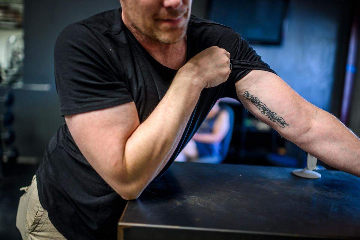 Trae deBeaubien in his Jackson gym in 2019 shows the matching tattoo he got with girlfriend Mary Wheat, who was fatally shot by off-duty CHP officer Brad Wheat, her estranged husband in 2018. “My peace my happiness,” it reads.