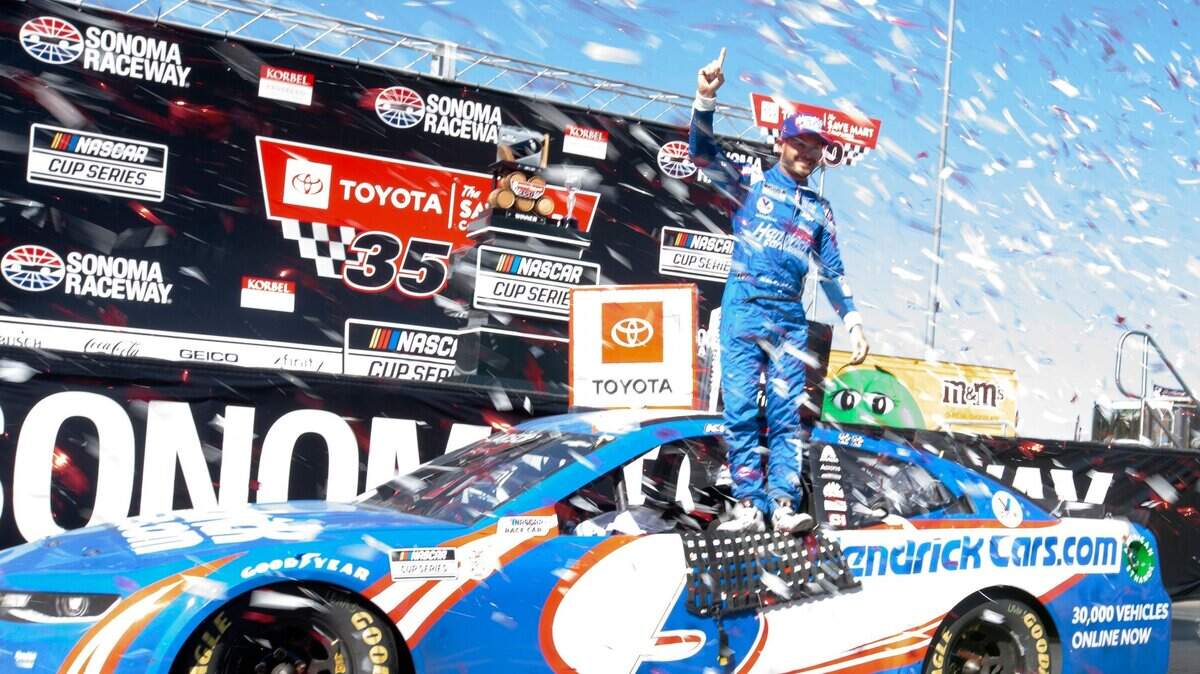 Elk Grove’s Kyle Larson stands atop his car after winning the Toyota/Save Mart 350 in the NASCAR Cup Series at Sonoma Raceway on Sunday in Sonoma.