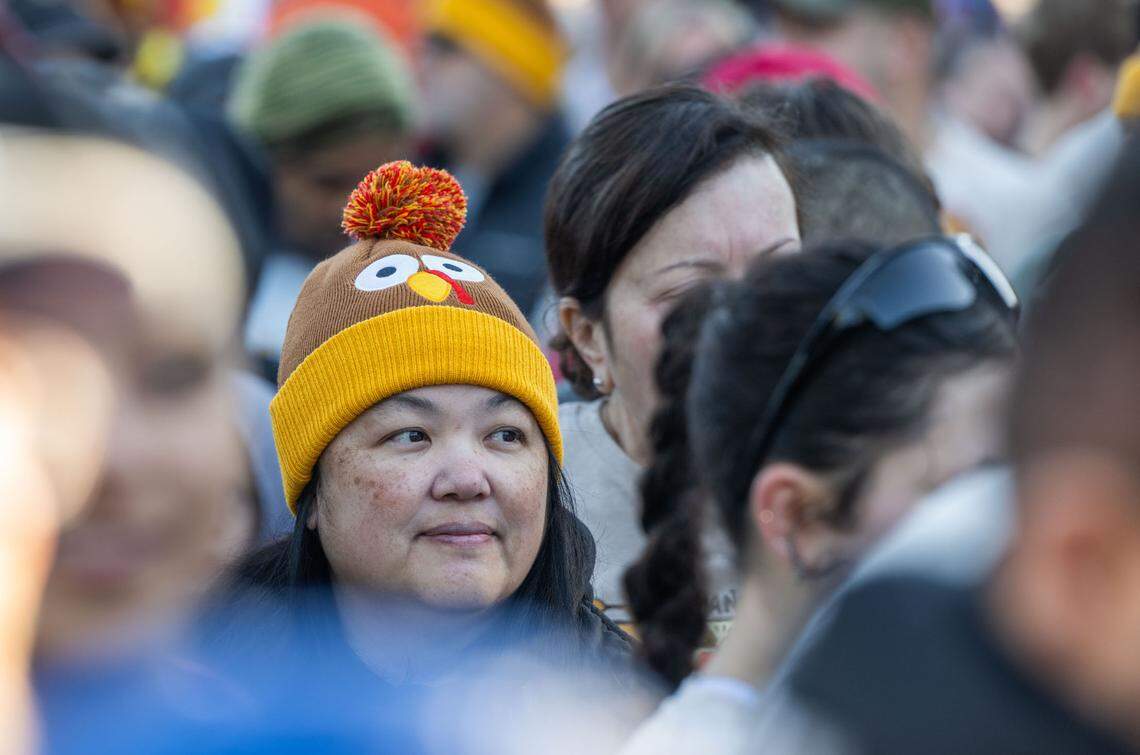 Karen Dixon wears a turkey hat as she prepares to participate in the Run to Feed the Hungry on Thursday.