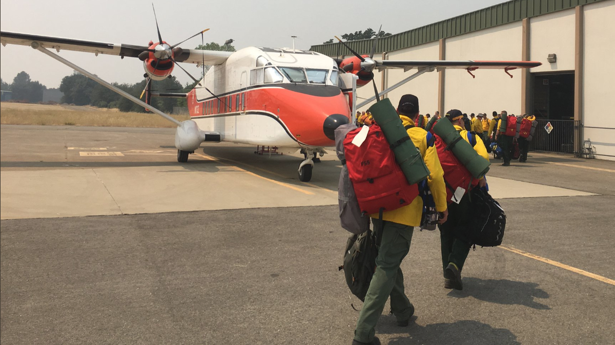 Australian and New Zealand firefighters arrive in Redding on Monday to help fight blazes around Northern California.