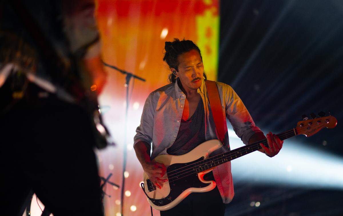 Billy Kim plays the bass as Sacramento band Tycho performs during the opening weekend for Channel 24, a new concert venue in midtown, on Friday. The band is led by Scott Hansen on the synthesizers and also features guitarist Zac Brown and drummer Rory O’Connor.