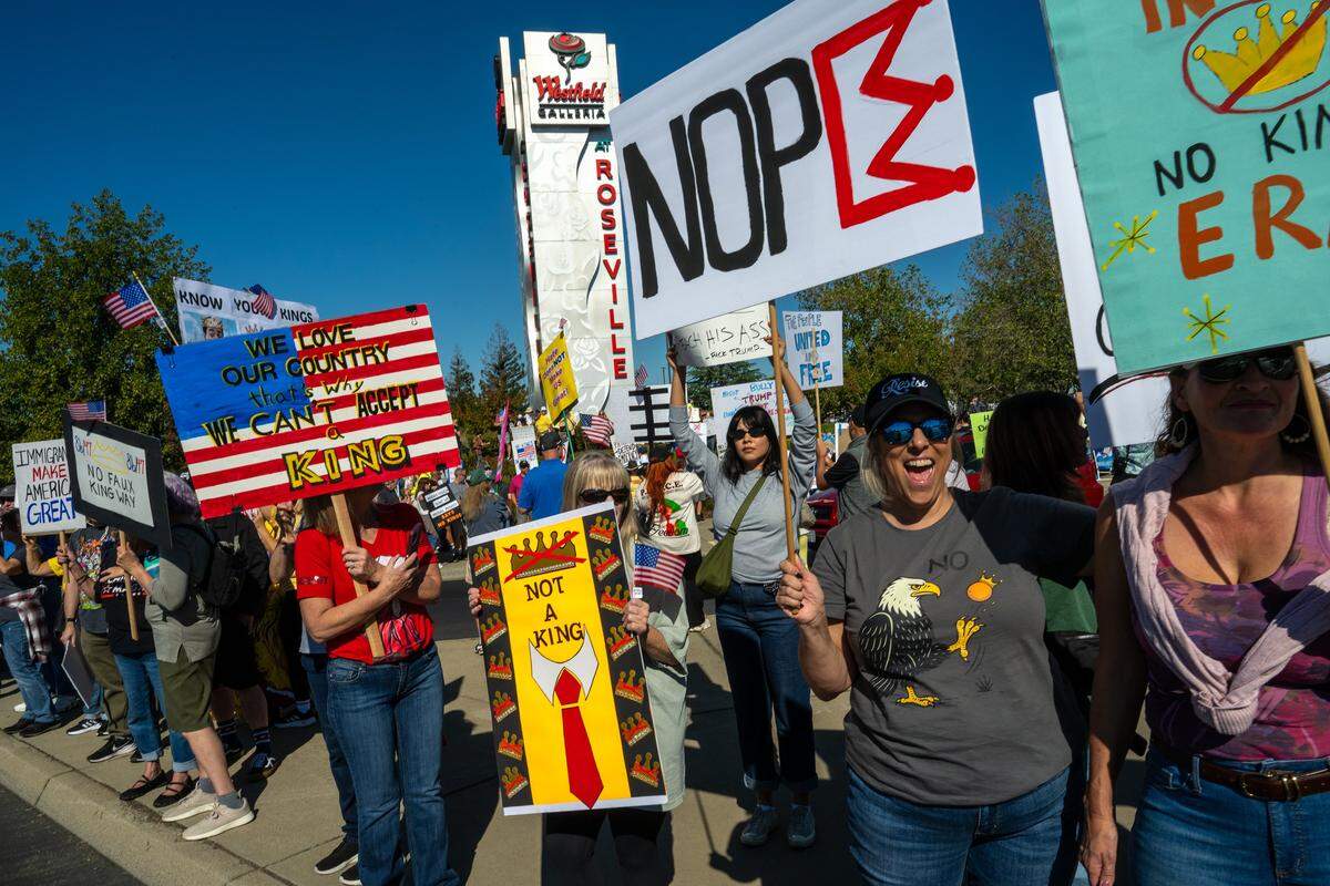 Demonstrators participate in a "No Kings" protest on Saturday, Oct. 18, 2025, in Roseville.