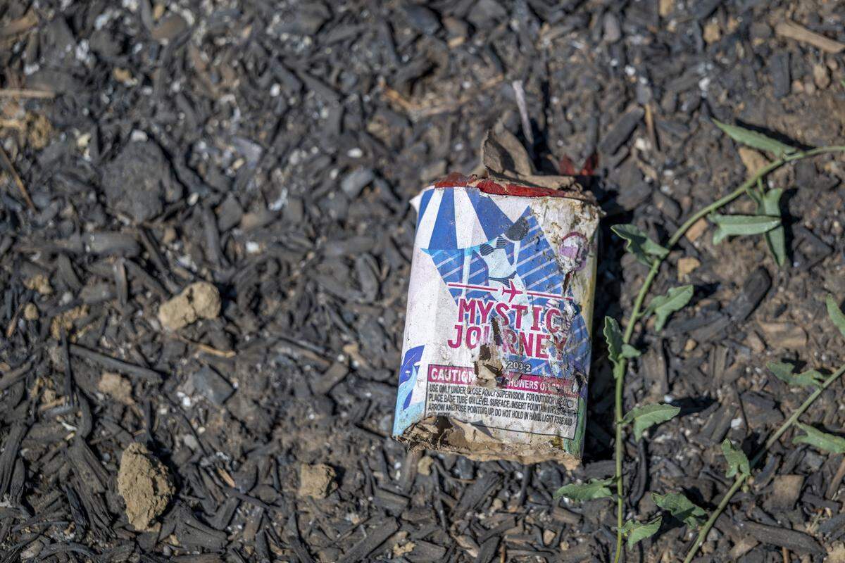 The remnants of a firework sit near the site of the Devastating Pyrotechnics explosion in Esparto on July 21.
