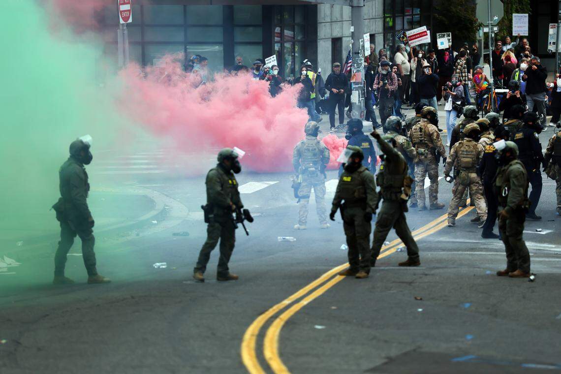 Federal agents, including members of the Department of Homeland Security, the Border Patrol, and police, clash with protesters outside a downtown U.S. Immigration and Customs Enforcement facility on Saturday, Oct. 4, 2025 in Portland, Ore. The facility has become a focal point of nightly protests against the Trump administration and his announcement that he will be sending National Guard troops into the city.