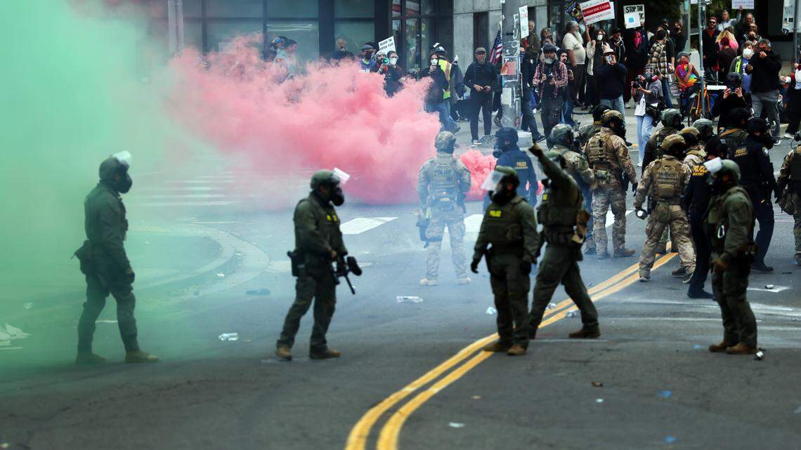 Federal agents, including members of the Department of Homeland Security, the Border Patrol, and police, clash with protesters outside a downtown U.S. Immigration and Customs Enforcement facility on Saturday, Oct. 4, 2025 in Portland, Ore. The facility has become a focal point of nightly protests against the Trump administration and his announcement that he will be sending National Guard troops into the city.