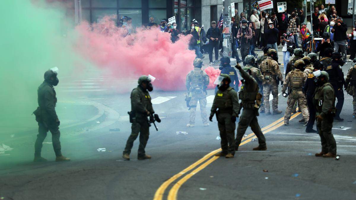 Federal agents, including members of the Department of Homeland Security, the Border Patrol, and police, clash with protesters outside a downtown U.S. Immigration and Customs Enforcement facility on Saturday, Oct. 4, 2025 in Portland, Ore. The facility has become a focal point of nightly protests against the Trump administration and his announcement that he will be sending National Guard troops into the city.