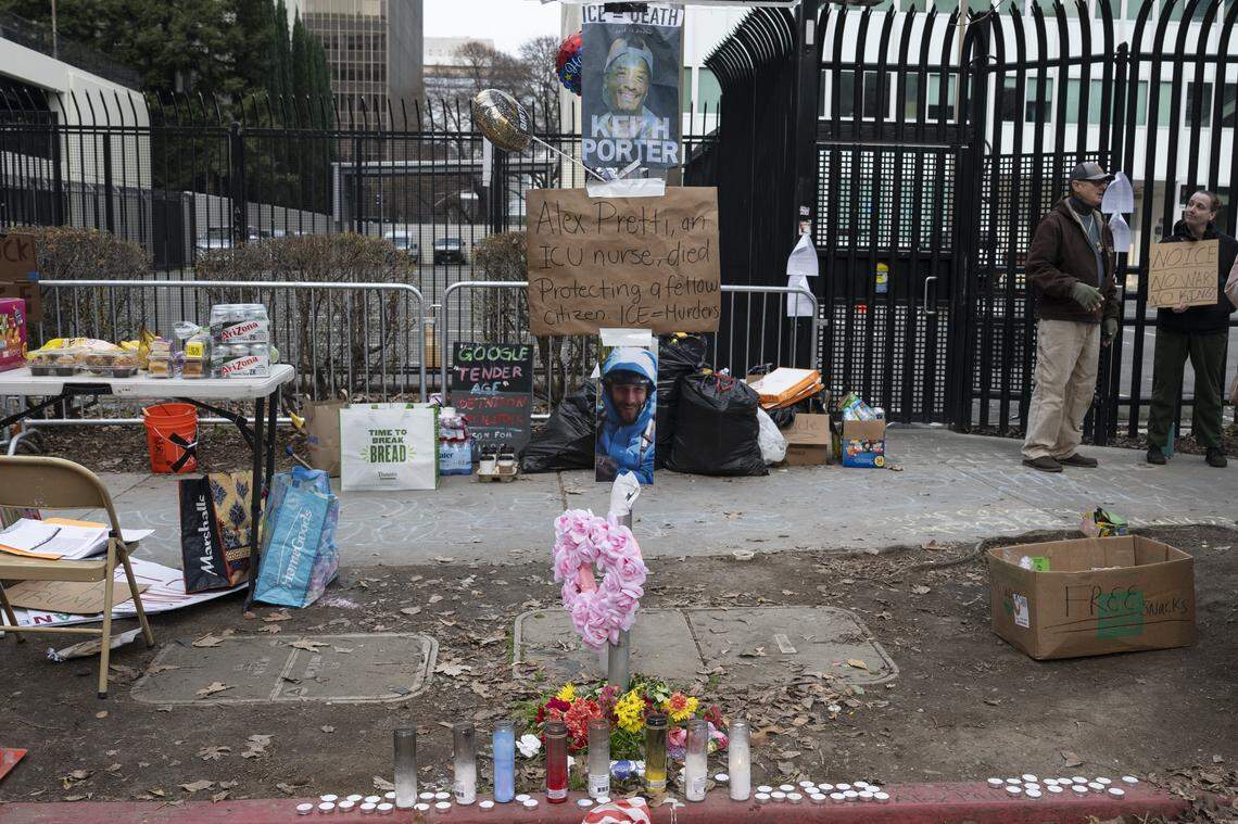 A memorial for Alex Pretti, who was killed in Minneapolis on Jan. 24, is decorated with candles and signs during a protest outside the John Moss Federal Building in Sacramento on Sunday.