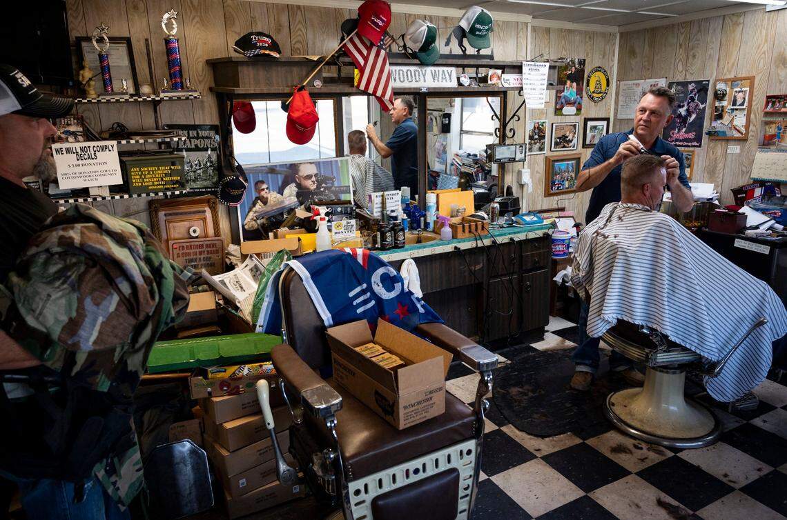 Cottonwood Barber Shop owner Woody Clendenen, leader of a local militia group, cuts Rodney Dunham’s hair Thursday, Oct. 22, 2020, in the rural Shasta County community of Cottonwood. “So the State of Jefferson is really all about representation,” he said. “We’re hoping to, through the court process, separate from California, and have our own state up here with more like-minded folks, we can represent ourselves.”