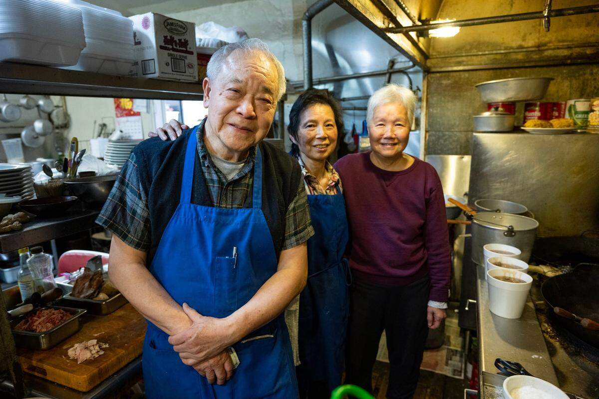 Chicago Cafe owners Paul and Nancy Fong, with sister-in-law Elisa Fong, right, stand in the kitchen in Woodland in February. The restaurant began serving customers in 1910, though its origins could stretch back to 1903, as printed on menus.