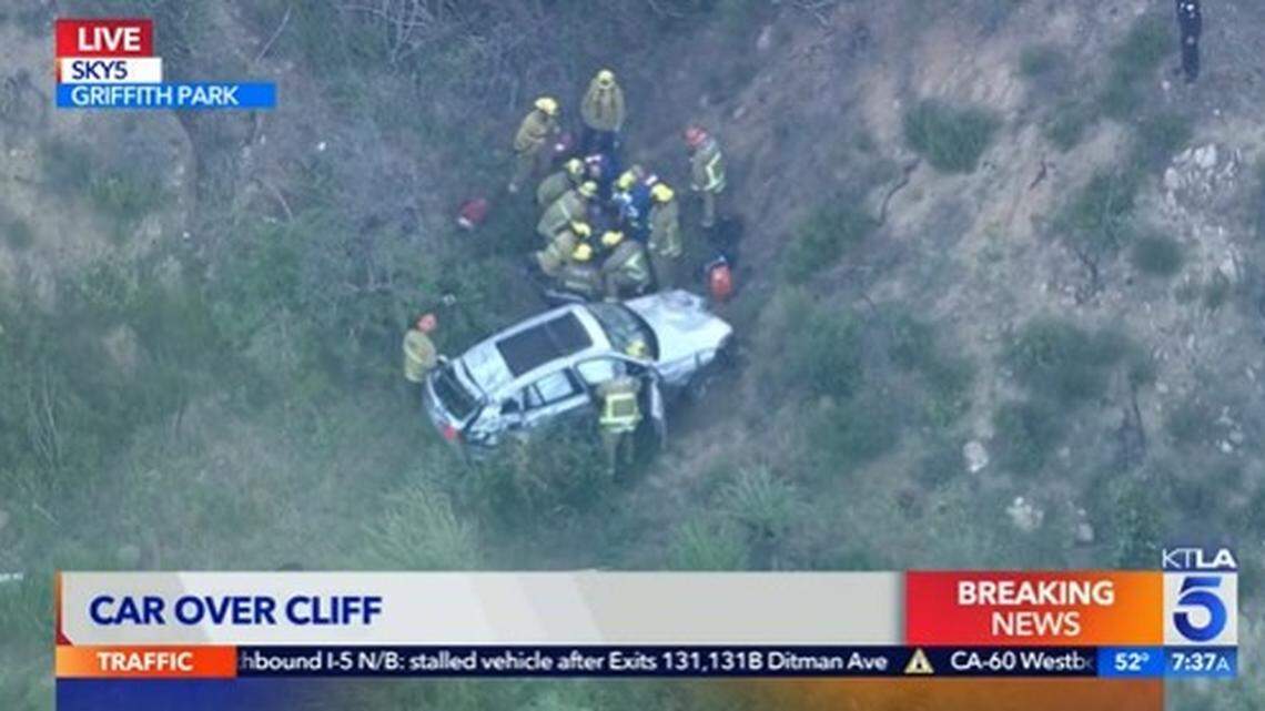 Firefighters hoisted a 68-year-old woman to safety after a car fell 300 feet down a cliff near Griffith Park in Los Angeles, California firefighters said.