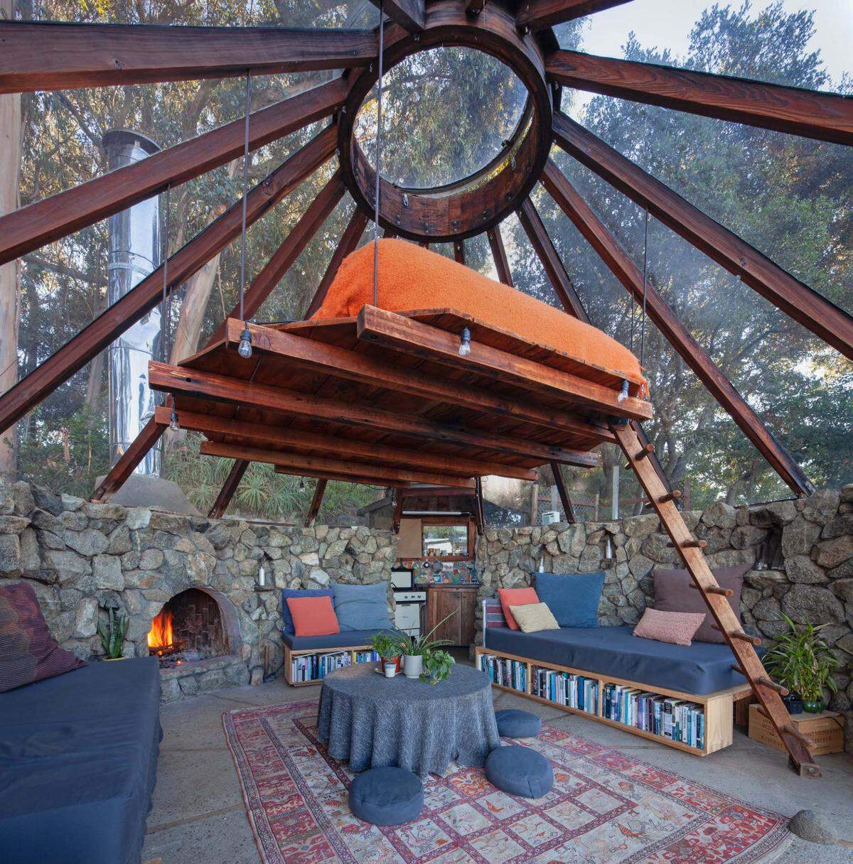 The 30-acre Big Sur estate of architect Mickey Muennig has hit the market for $6.95 million. It includes a glass structure referred to as “the Big Sur Greenhouse” that features natural stone walls, an incredible suspended bed and glass tepee-style roof.