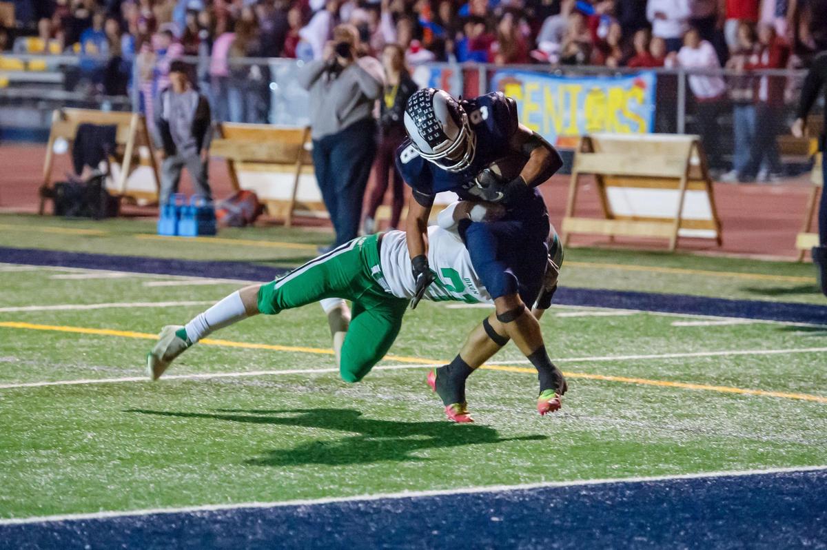 Casa Roble Rams running back Josh Taylor (8) rushes for 15 yards for a touchdown past Dixon Rams Matthew Whitaker (21) during the first quarter in the game Friday, Oct. 28, 2022, at Casa Roble High School in Orangevale.
