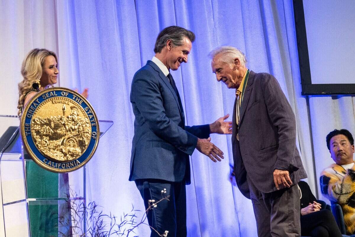 Gov. Gavin Newsom shakes hands with artist Ed Ruscha during the California Hall of Fame induction ceremony on Tuesday, Dec. 13, 2022, in Sacramento.