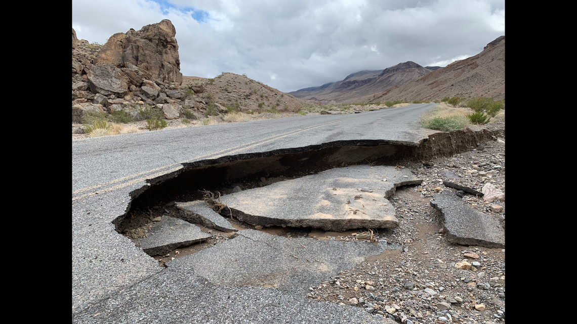 Flooding undercut the road, causing pavement loss.