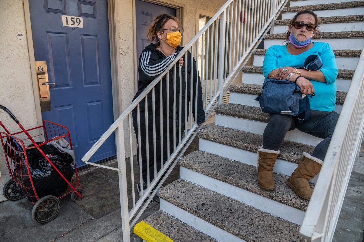 Betty Rios, 48, left, and Alisia Naranjo, 41, right, were staying temporarily at a Motel 6 on March 23. Both suffer from underlying conditions that make them more susceptible to getting COVID-19. Rios was accepted in the Project Roomkey program at the Vagabond Inn but was asked to leave. Naranjo said she was recently released from the hospital after a surgery but never got into the program.