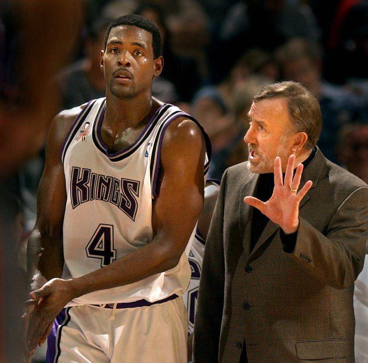 The Sacramento Kings’ Chris Webber gets instruction from coach Rick Adelman during a timeout against the Phoenix Suns Jan. 13, 2002 at Arco Arena.