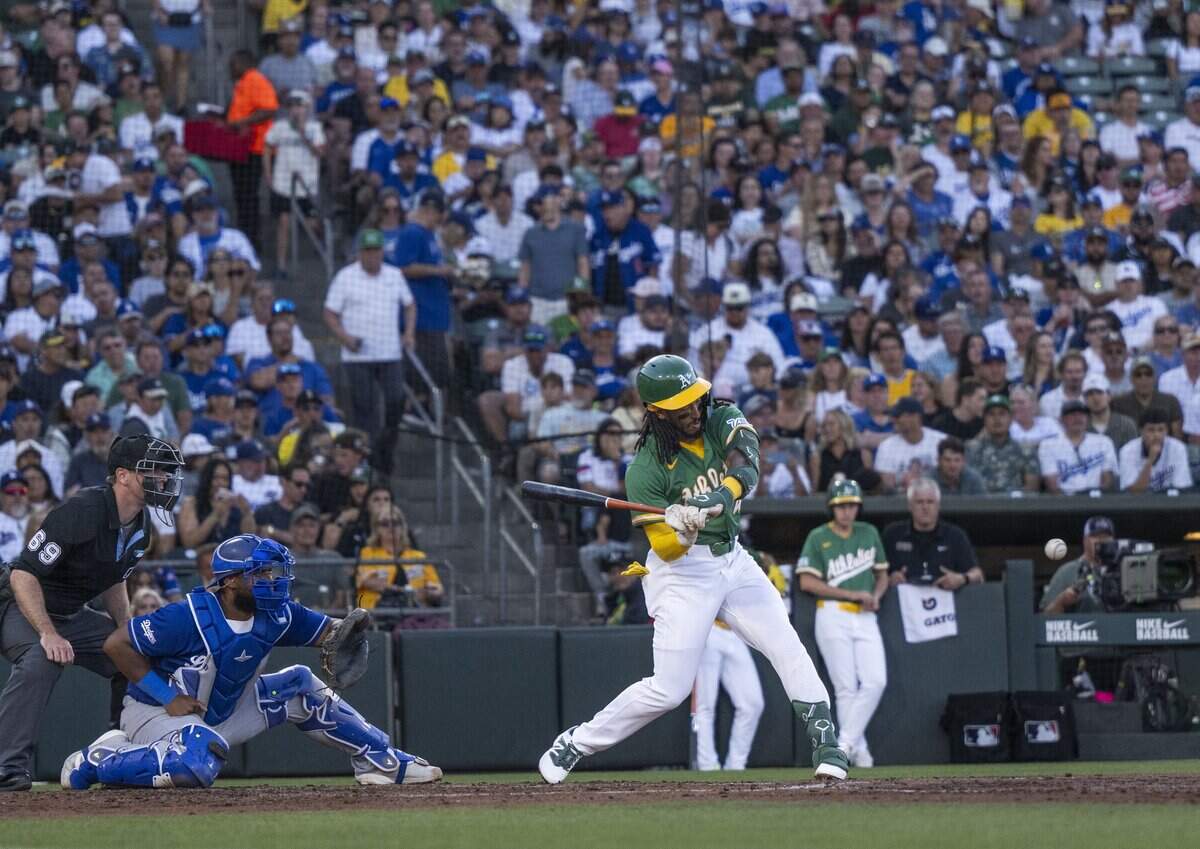 Athletics third baseman Joshua Kuroda-Grauer gets a hit against the Los Angeles Dodgers at Sutter Health Park in West Sacramento on Wednesday.