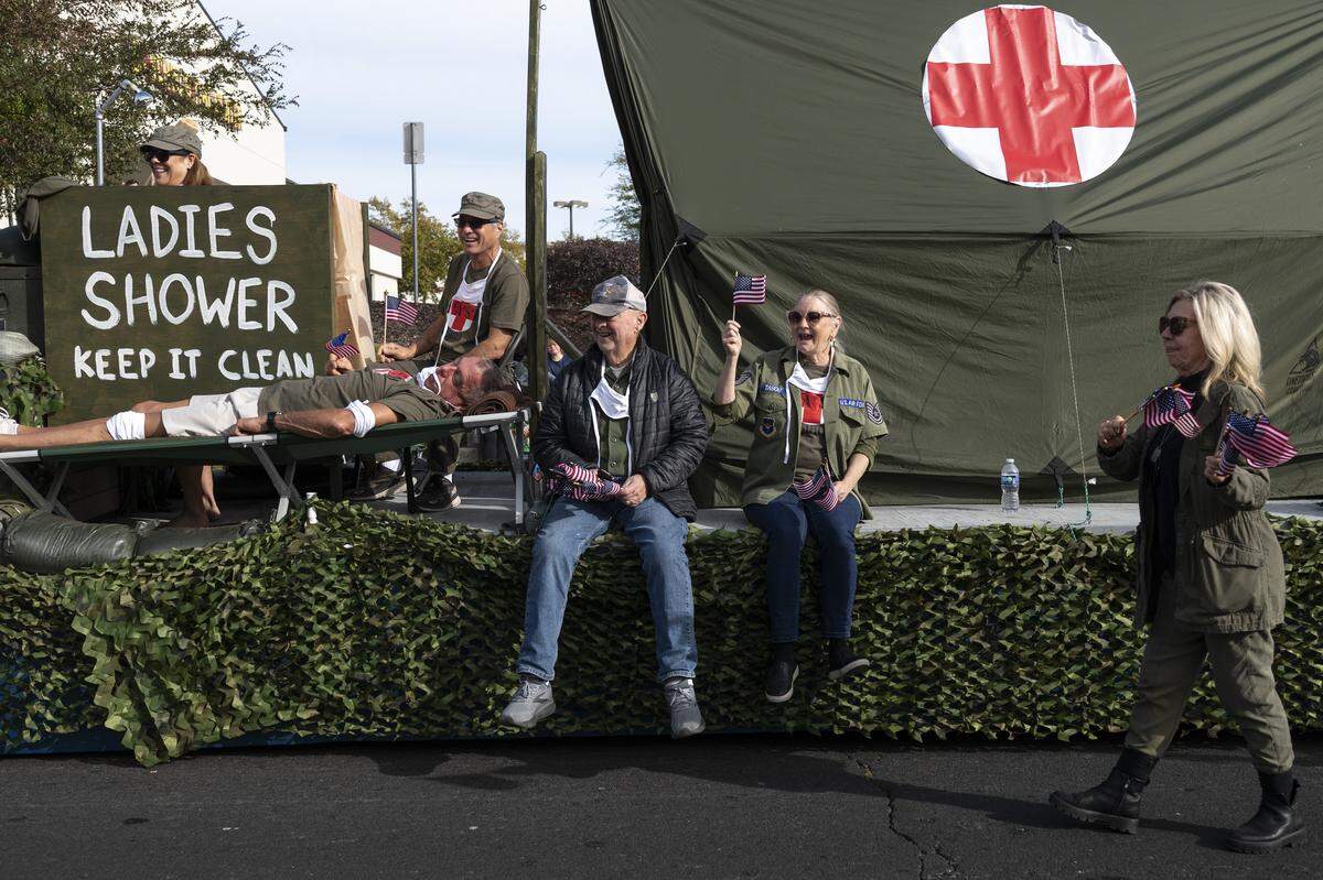 A float themed around the TV show MASH rolls down East Bidwell Street during a Veterans Day parade in Folsom on Tuesday, Nov. 11, 2025.