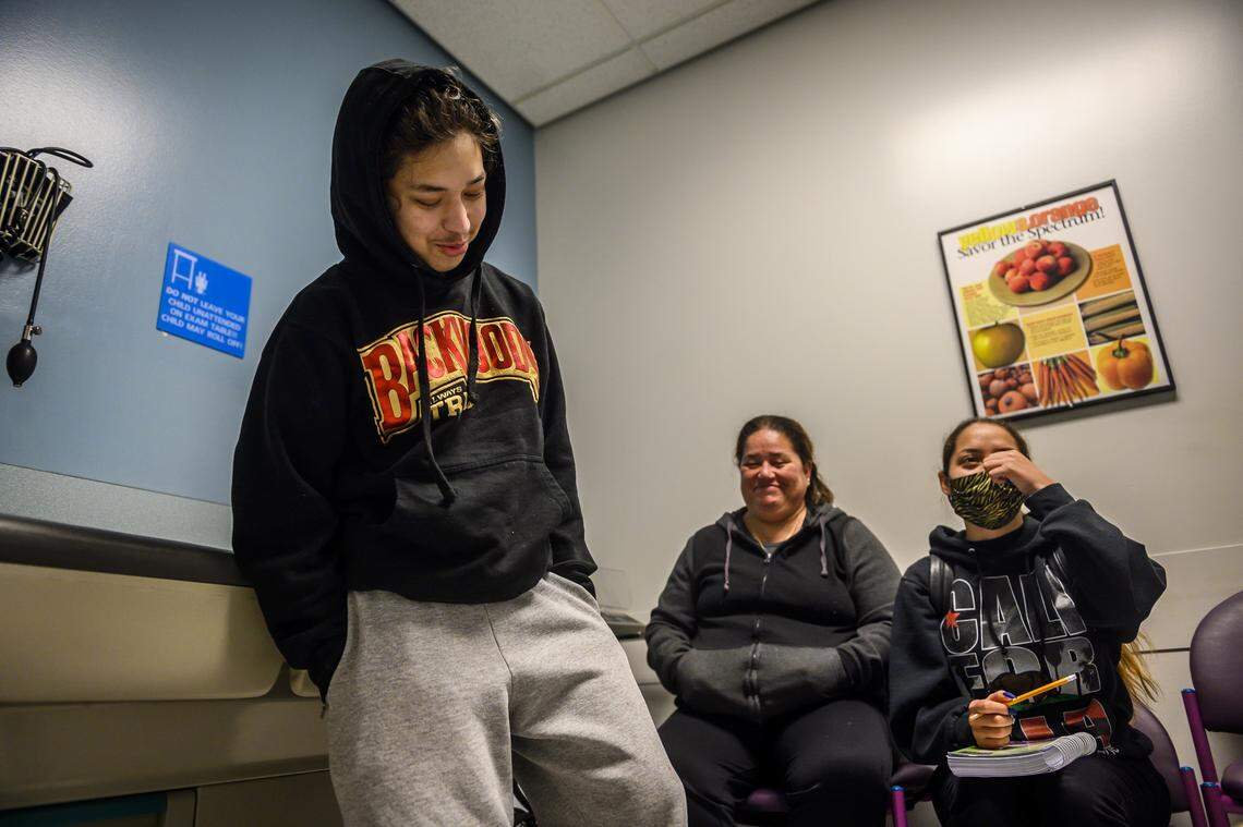Alex Gonzalez laughs with his family as he has a post surgery check up Thursday, April 9, 2020, after having a kidney transplant two weeks prior at UC Davis Medical Center in Sacramento. Gonzalez received the kidney from a deceased donor after one donated by his mother failed. He and his family visit the hospital to get lab work done and to see how his body is accepting the new kidney.