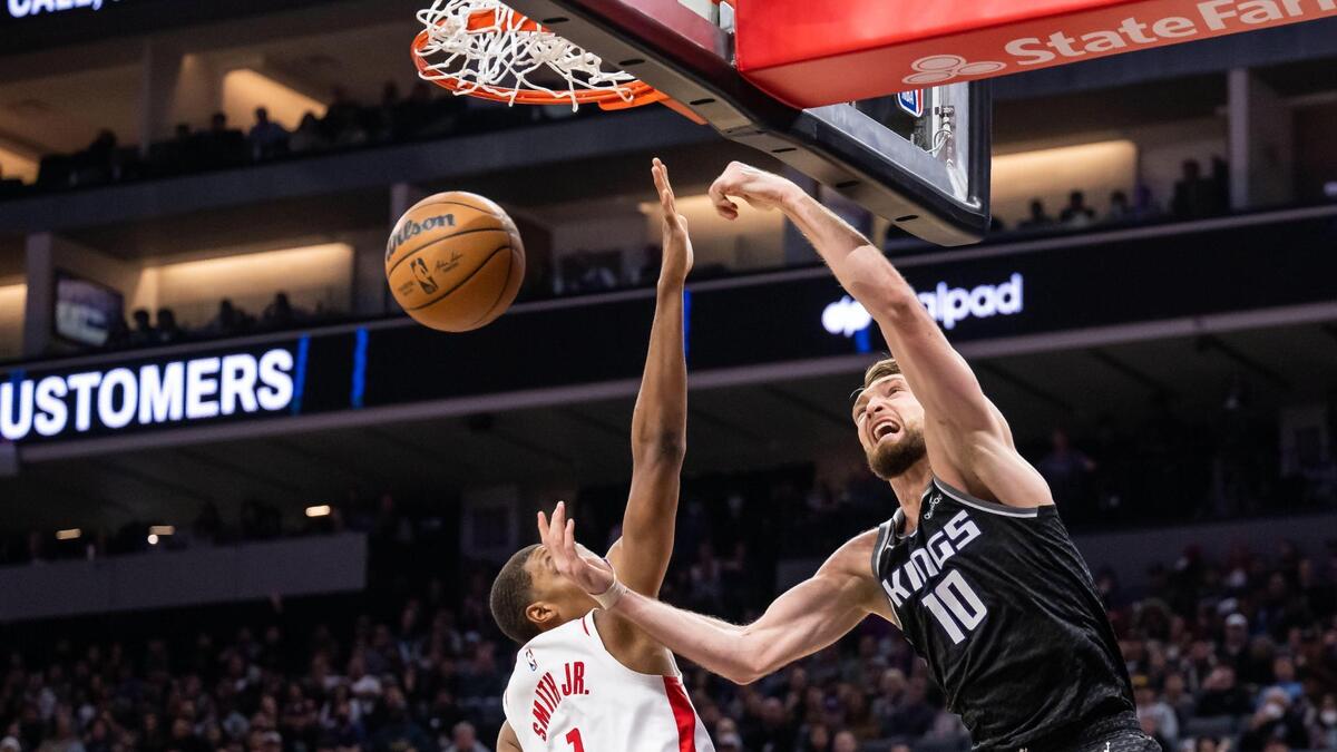 Sacramento Kings center Domantas Sabonis (10) slam dunks over Houston Rockets forward Jabari Smith Jr. (1) and yells out during the second quarter of the NBA basketball game Friday, Jan. 13, 2023, at Golden 1 Center in Sacramento.