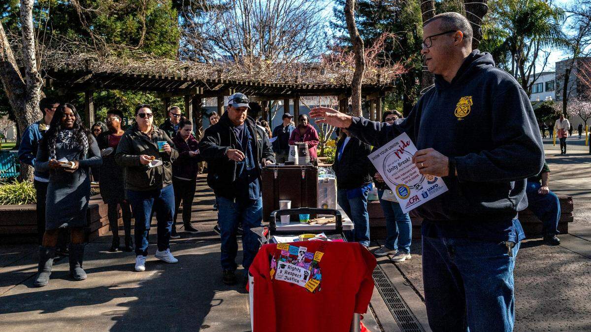 Matt Mason, an automotive service technician and campus steward for Teamsters Local 2010 in Sacramento, speaks during a Unity Break event on campus Wednesday, Feb. 15, 2023, in support of a stepped-based compensation structure for CSU workers.