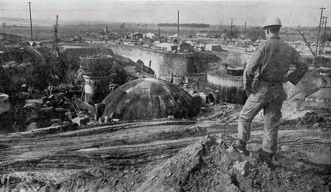 Lt. Frank McDonald, resident engineer for the U.S. Army Corps of Engineers at the Placer County site of the Titan missile project, surveys the workings in February 1961 from a stockpile of dirt that was eventually pushed back around the finished structures. The large dome in the foreground is the power generation plant, while the tower-like object is the entry silo.